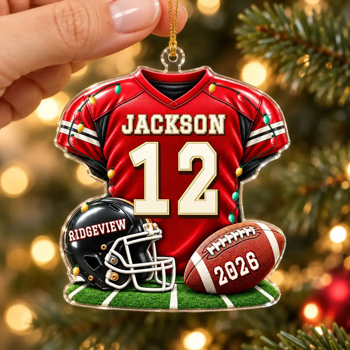 Football acrylic ornament held in hand
