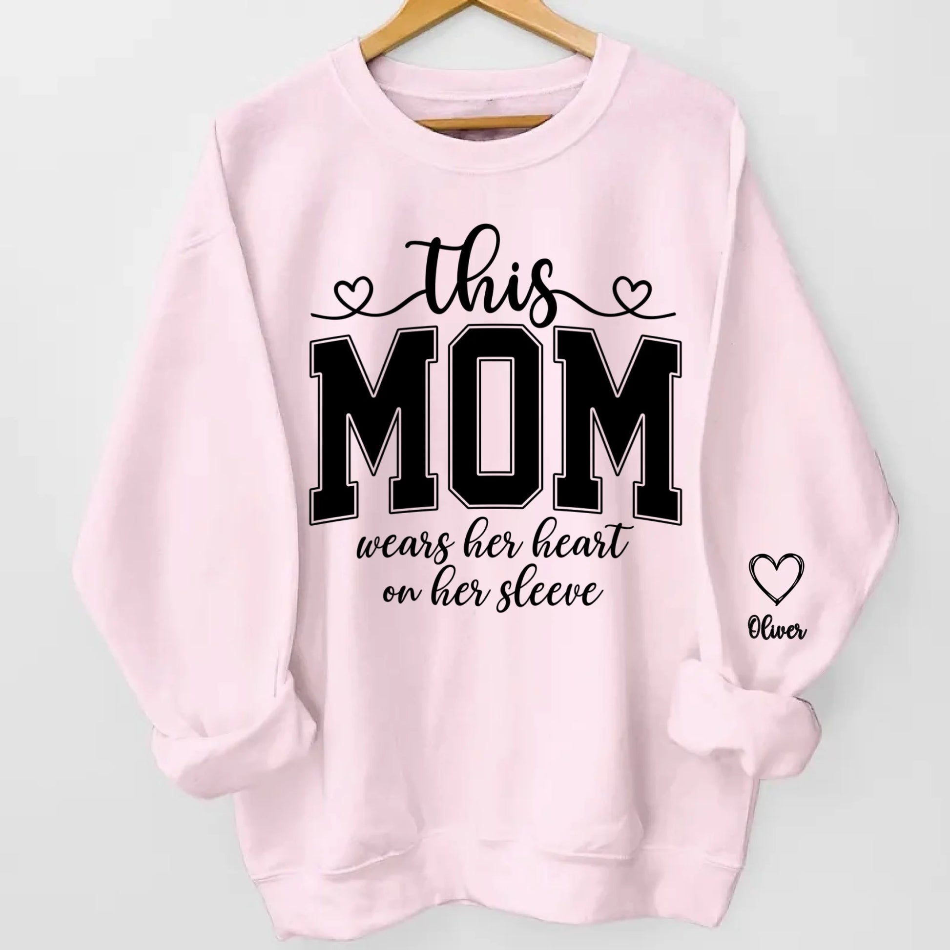 This Mom Wears Her Heart On Her Sleeve Sweatshirt – Personalized Gift for Moms with Kid’s Name