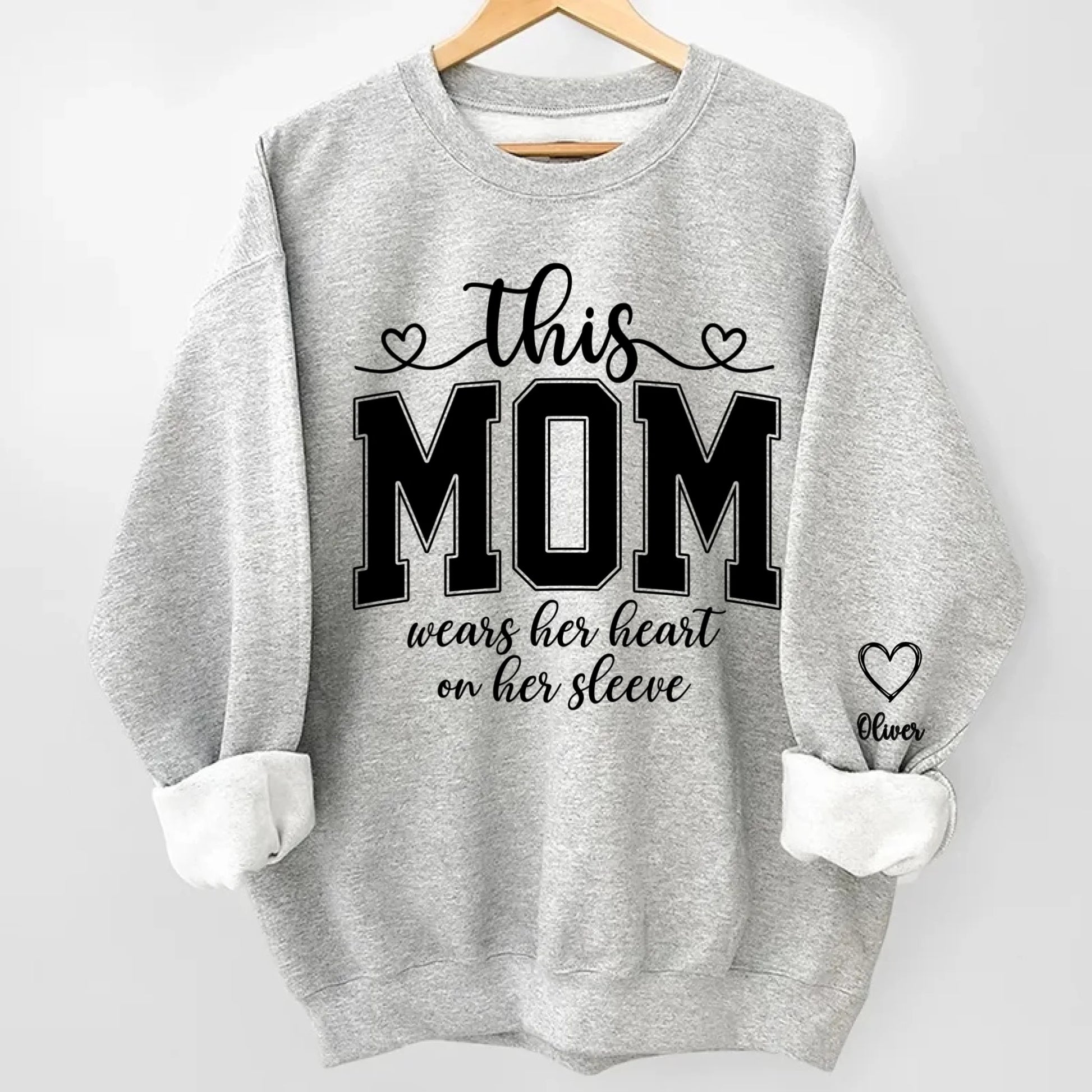 This Mom Wears Her Heart On Her Sleeve Sweatshirt – Personalized Gift for Moms with Kid’s Name