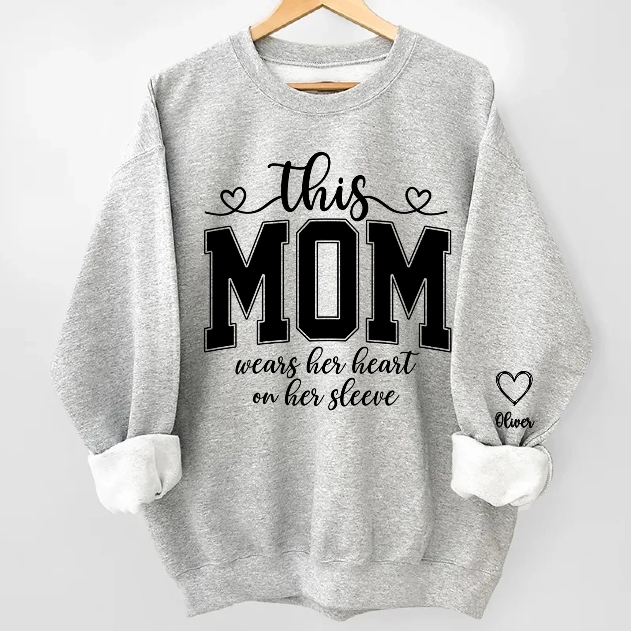 This Mom Wears Her Heart On Her Sleeve Sweatshirt – Personalized Gift for Moms with Kid’s Name