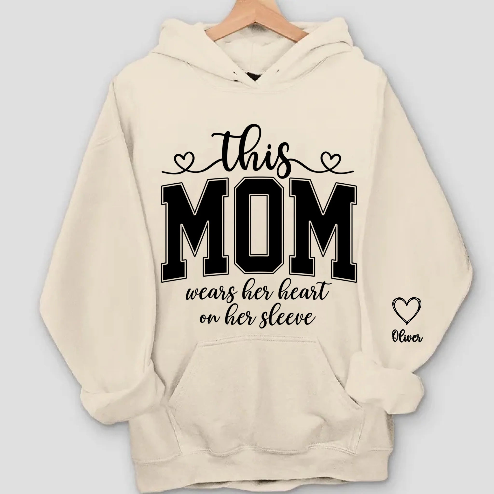 This Mom Wears Her Heart On Her Sleeve Sweatshirt – Personalized Gift for Moms with Kid’s Name
