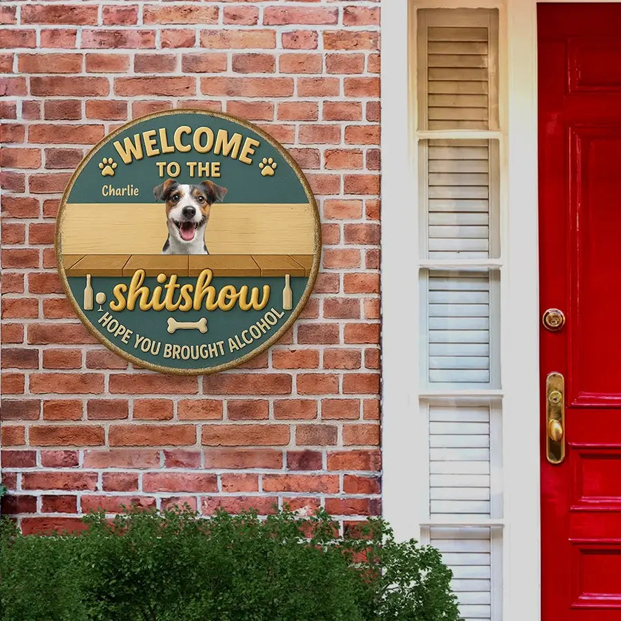 personalized metal signs with a dog's face on a brick wall next to a red door.