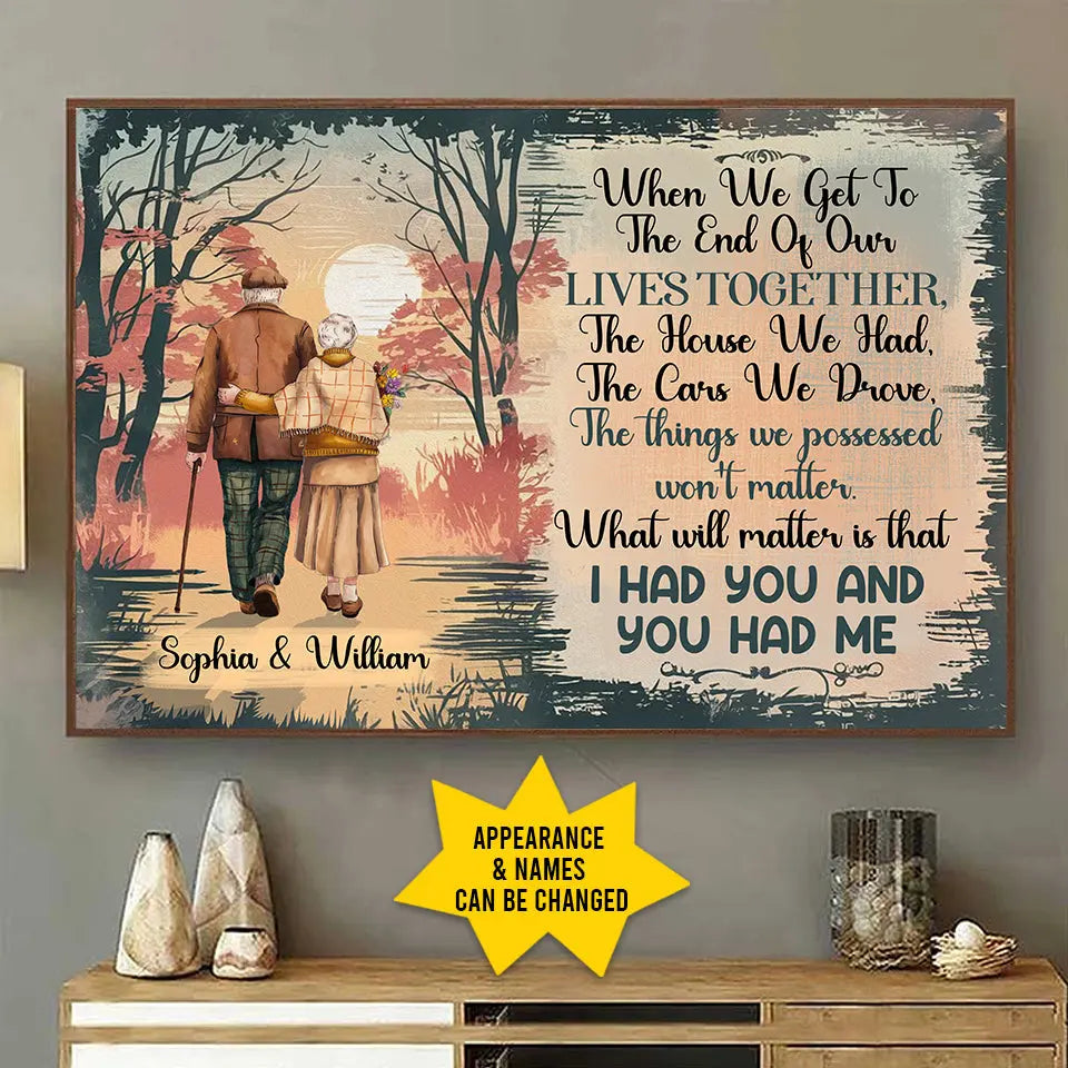 Old couple walking into autumn sunset poster