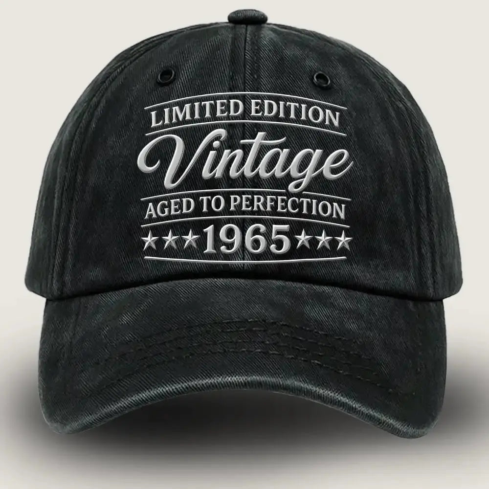 Black cap with white text 'Limited Edition Vintage Aged to Perfection 1965' on a light gray background