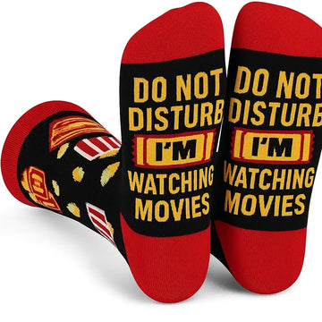 Pair of socks with 'Do Not Disturb, I'm Watching Movies' text on a white background