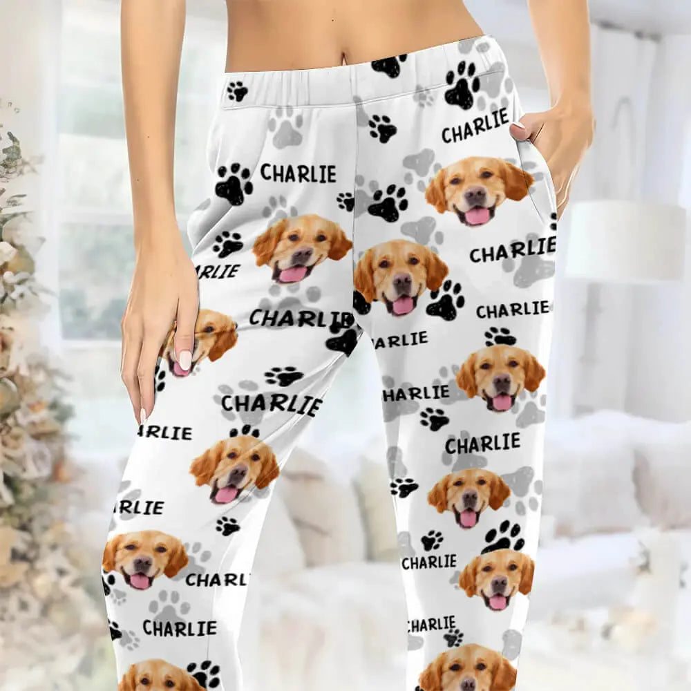 Pajama pants with a dog's face and name 'Charlie' printed on them.