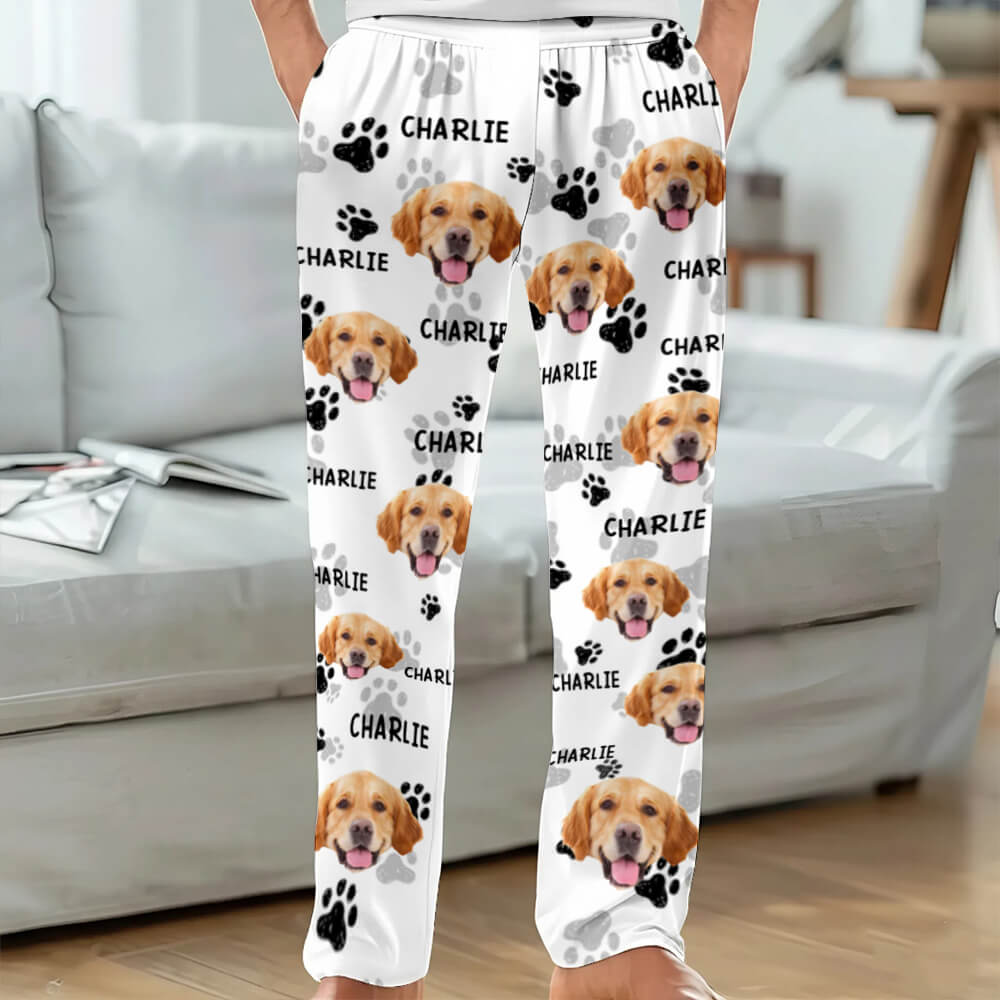 White pants with dog faces and 'Charlie' text in a living room setting