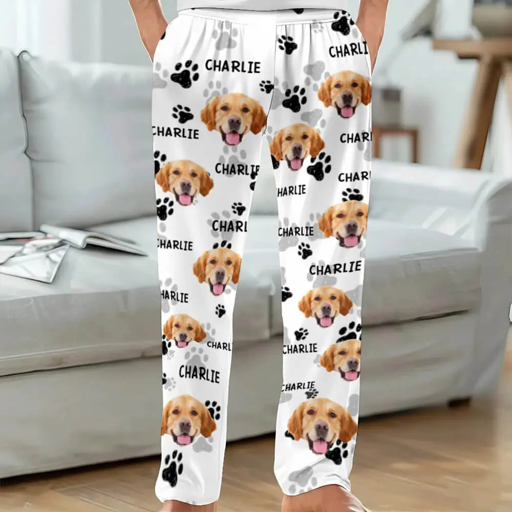 White pants with dog faces and 'Charlie' text in a living room setting