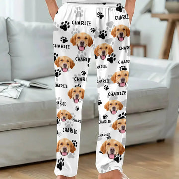 White pants with dog faces and 'Charlie' text in a living room setting